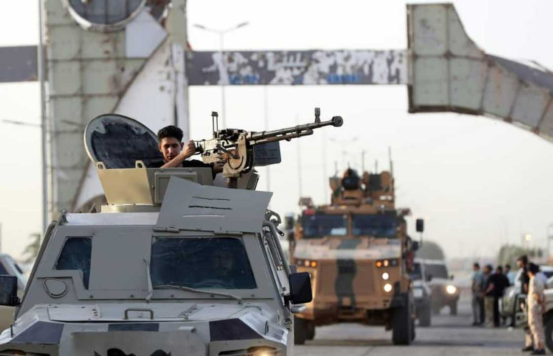 Joint forces affiliated with Libya's Government of National Unity assemble inside the closed Tripoli International Airport on August 16, 2022