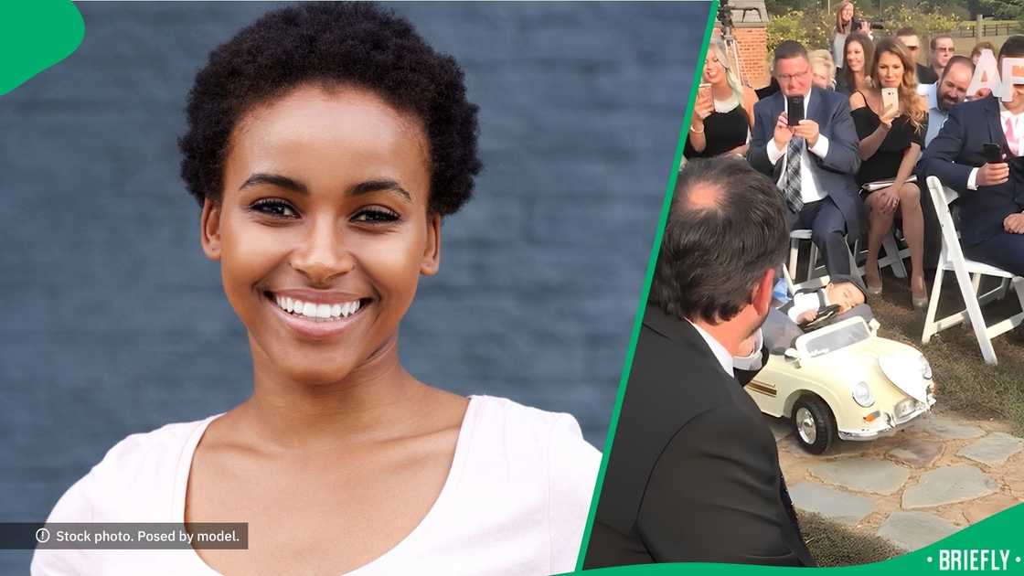 The little boy was placed in a remote-controlled toy car driving down the aisle The little boy was placed in a remote-controlled toy car driving down the aisle