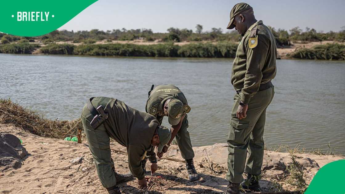 Border Management Authority (BMA) officers cut a cable used to pull makeshift boats across the Limpopo River near the Beitbridge border crossing on July 9, 2026