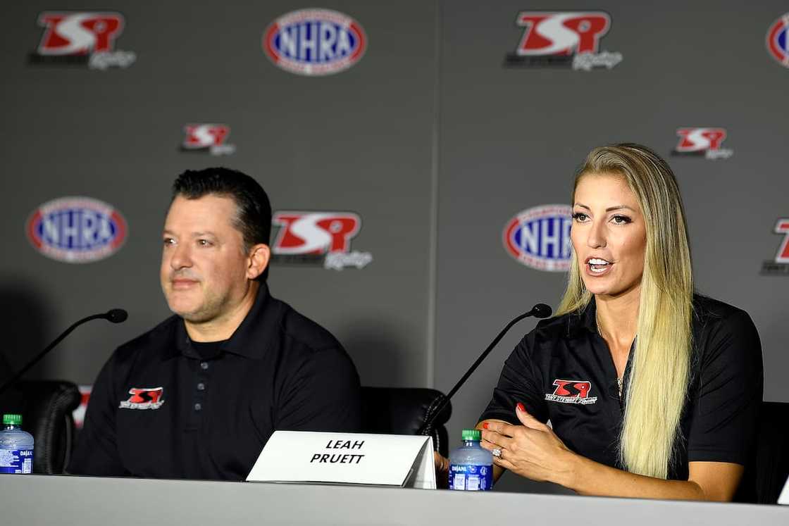 Tony Stewart and Leah Pruett during a press conference held in North Carolina at the zMAX Dragway in October 2021 Tony Stewart and Leah Pruett during a press conference held in North Carolina at the zMAX Dragway in October 2021