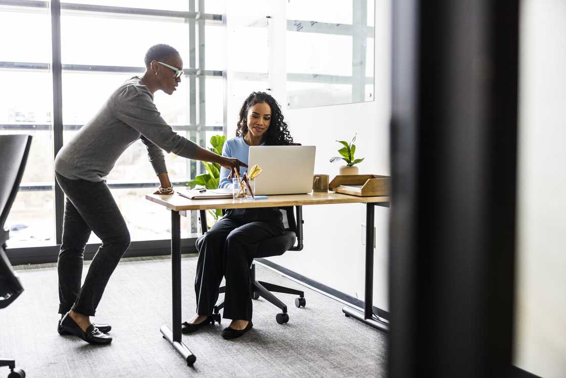 Two ladies in an office Two ladies in an office