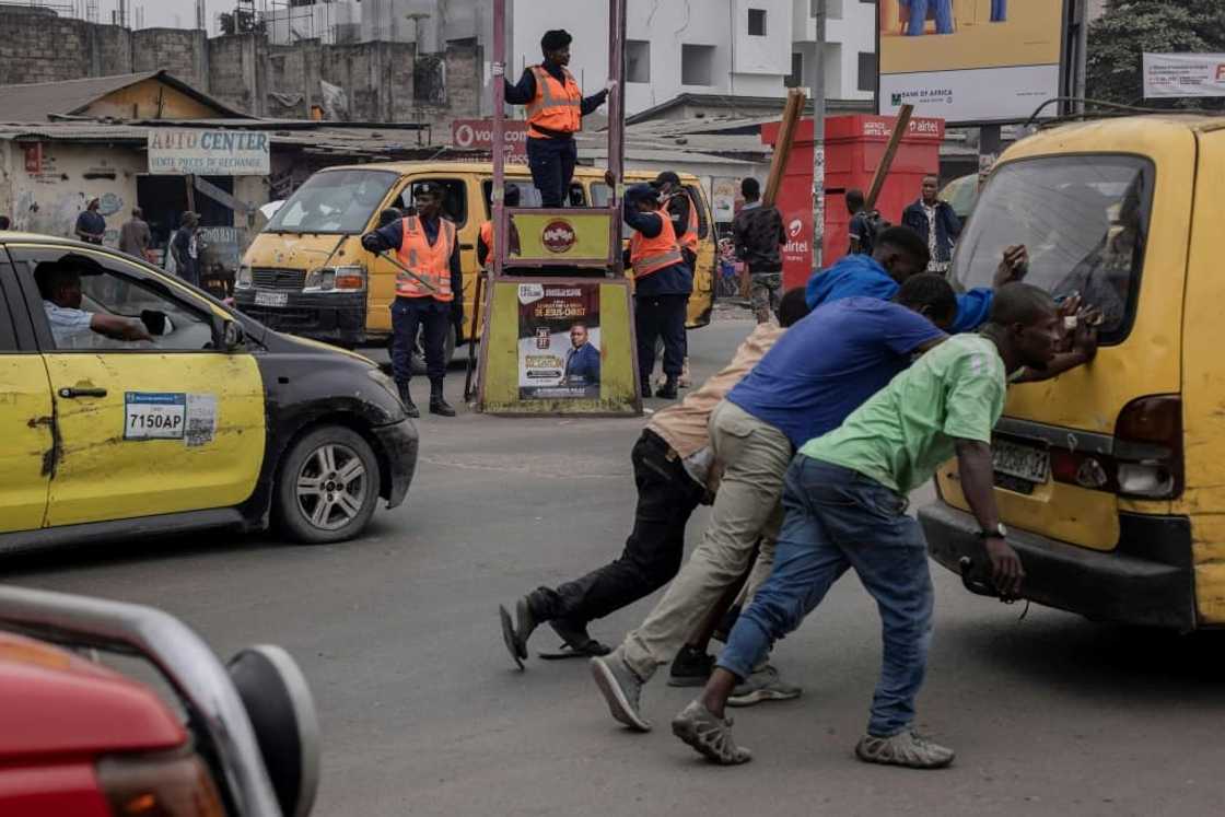 In Kinshasa, decrepit minibuses are known as 'spirits of death'