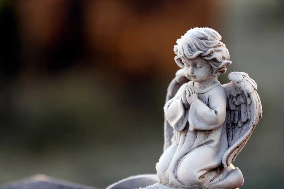 an angel statue in winter