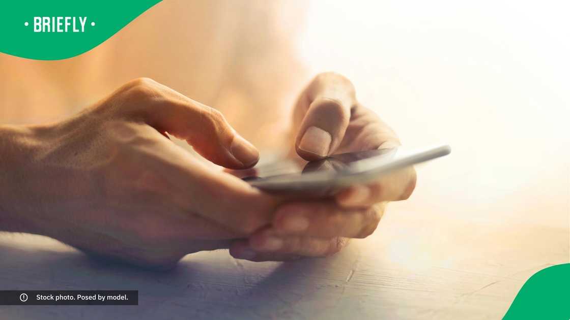 A person typing on their phone.