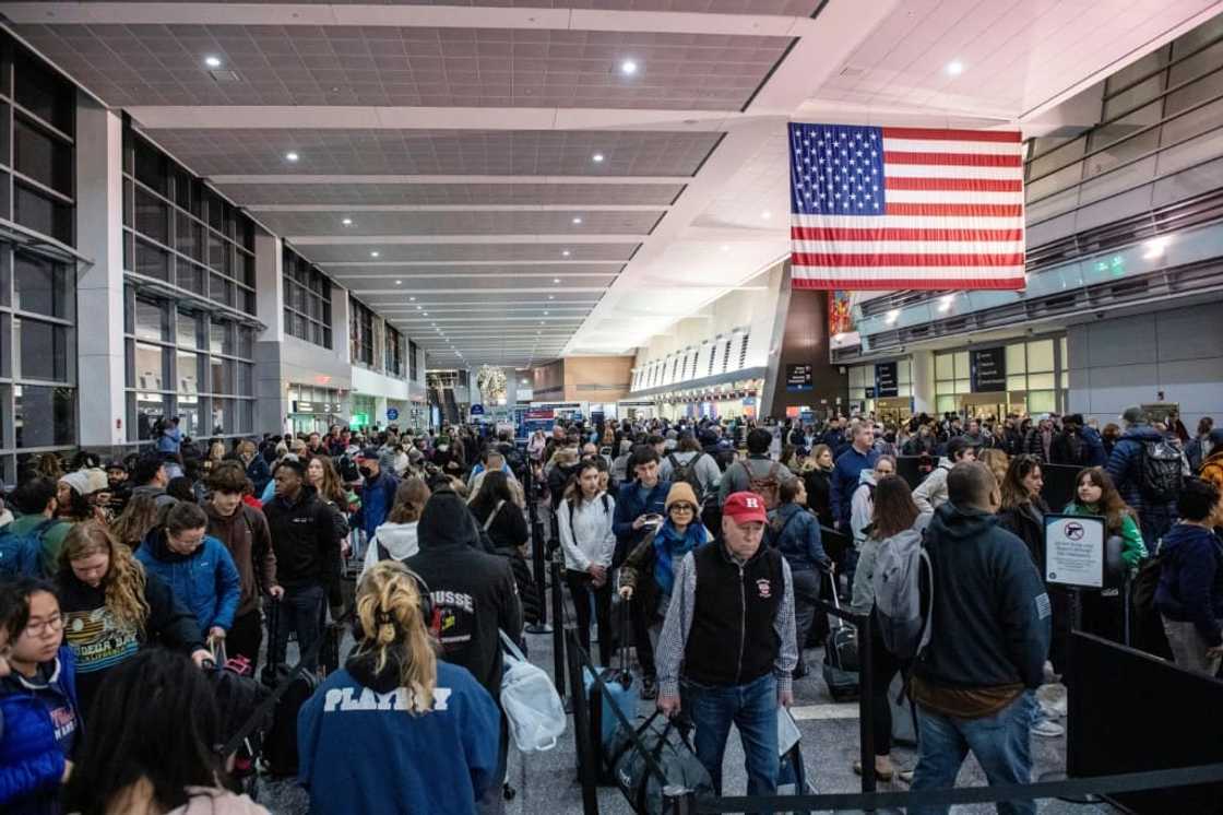 Travelers wait in the security line in Terminal A at Boston Logan International Airport in Boston, Massachusetts on December 21, 2023 Travelers wait in the security line in Terminal A at Boston Logan International Airport in Boston, Massachusetts on December 21, 2023