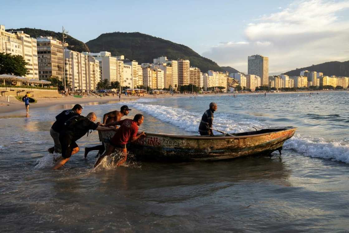 Long before acquiring its high-rises and international fame, Brazil's Copacabana beach was home to artisanal fishermen, who still ply the waters today