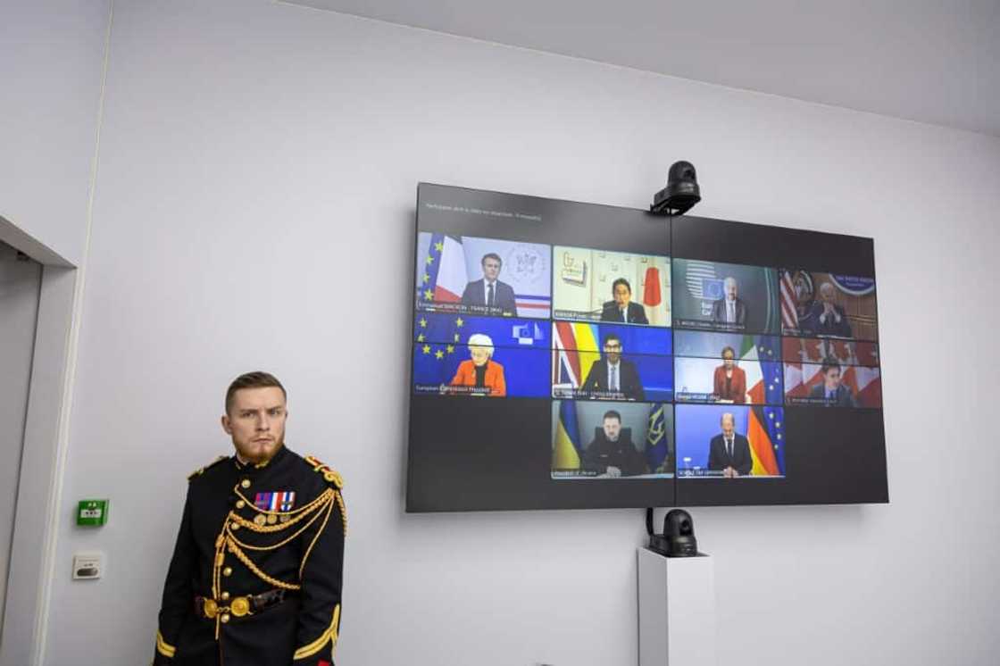 The United States rolled out new sanctions against Russia over its invasion of Ukraine in concert with G7 parnters -- the G7 leaders held a virtual meeting (seen on screen) to mark the anniversary of the invasion The United States rolled out new sanctions against Russia over its invasion of Ukraine in concert with G7 parnters -- the G7 leaders held a virtual meeting (seen on screen) to mark the anniversary of the invasion