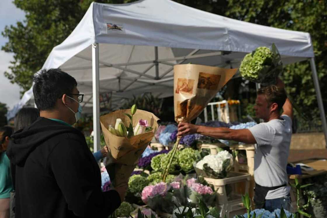 Flower sellers at the Columbia Road market in London told AFP they have been very busy Flower sellers at the Columbia Road market in London told AFP they have been very busy