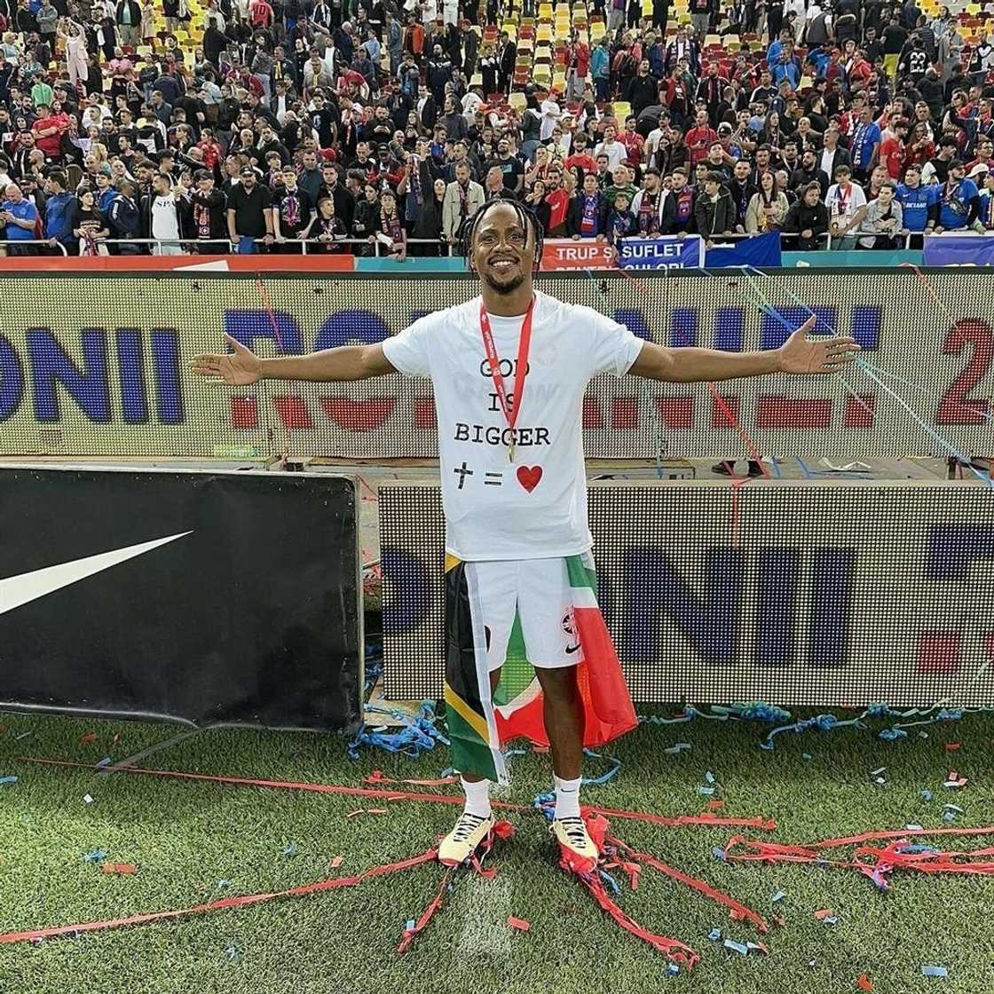 Former Chiefs star Ngezana lifts the SuperLiga trophy after stellar season. Former Chiefs star Ngezana lifts the SuperLiga trophy after stellar season.