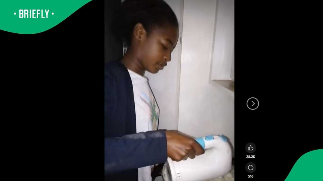 A young woman stirring pap. A young woman stirring pap.