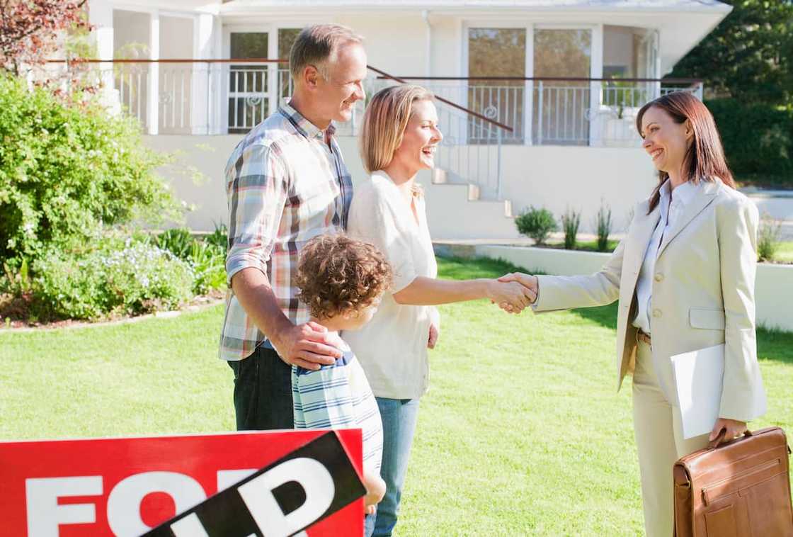A realtor with her clients A realtor with her clients