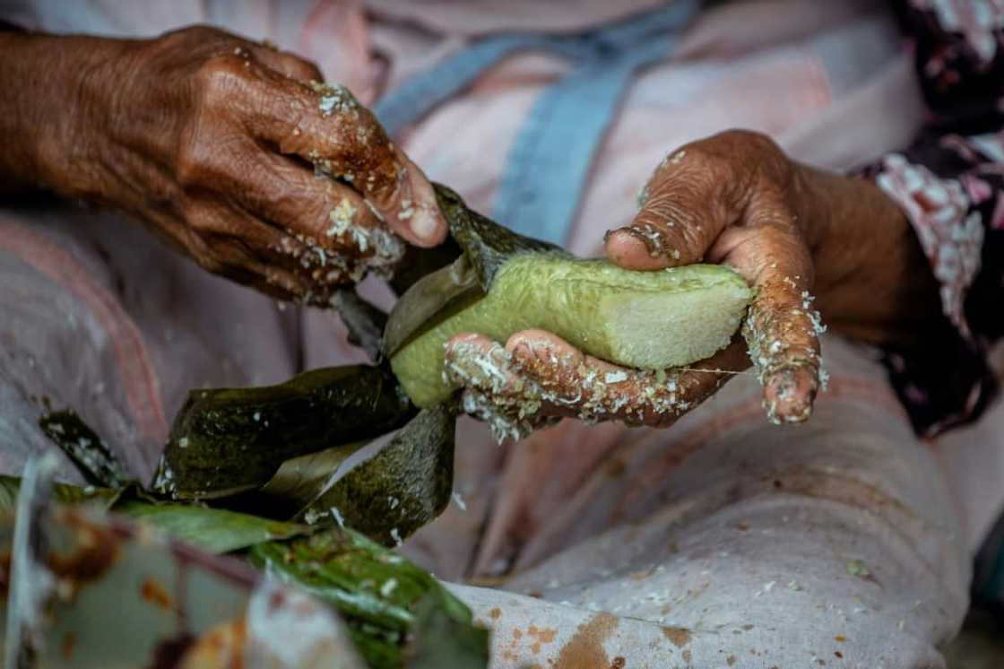 Lupis, a traditional sweet dish, is made from glutinous rice and served with grated coconut and liquid palm sugar Lupis, a traditional sweet dish, is made from glutinous rice and served with grated coconut and liquid palm sugar