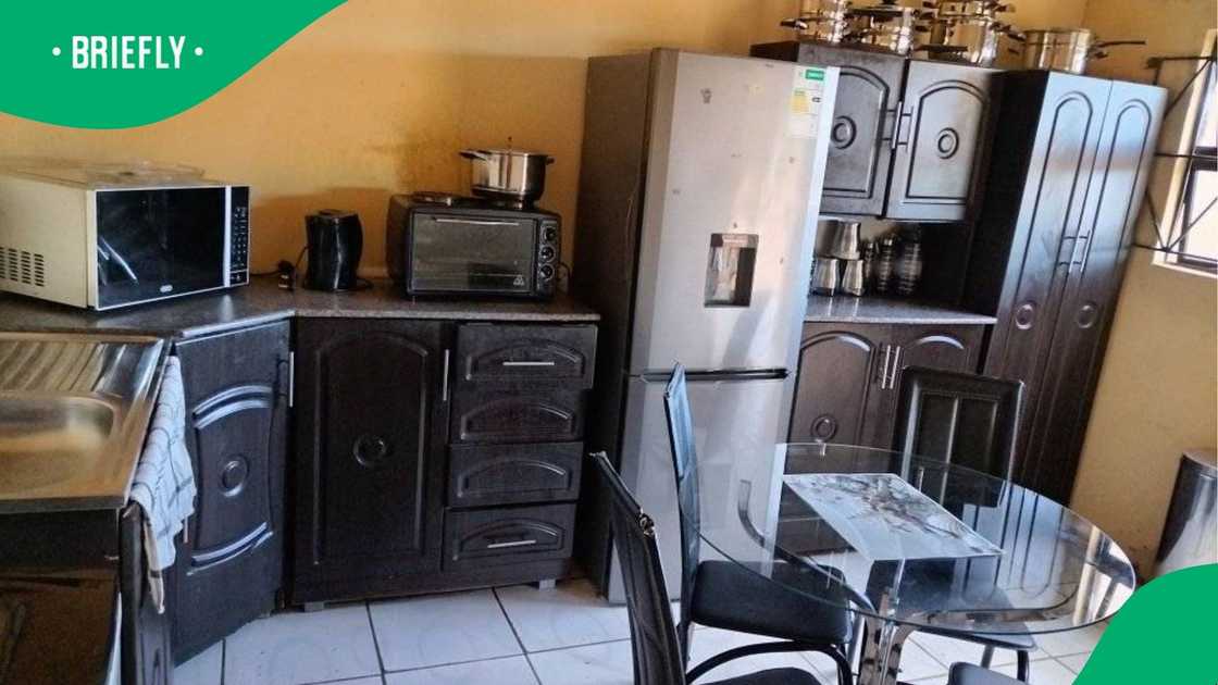 A woman showed her kitchen. A woman showed her kitchen.