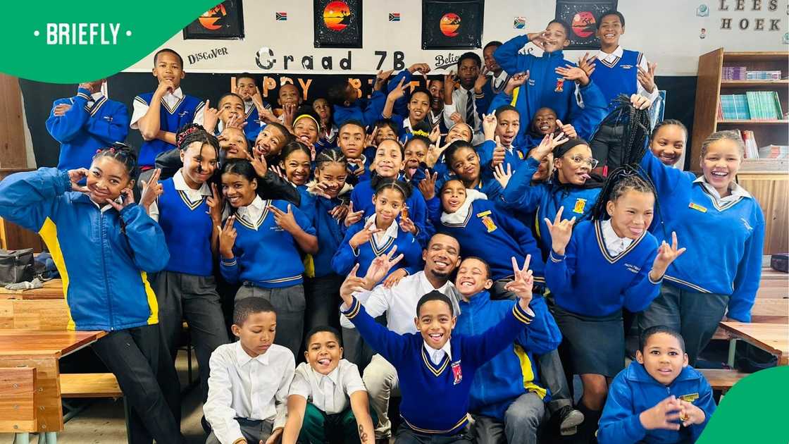 A meneer posed with his class learners A meneer posed with his class learners