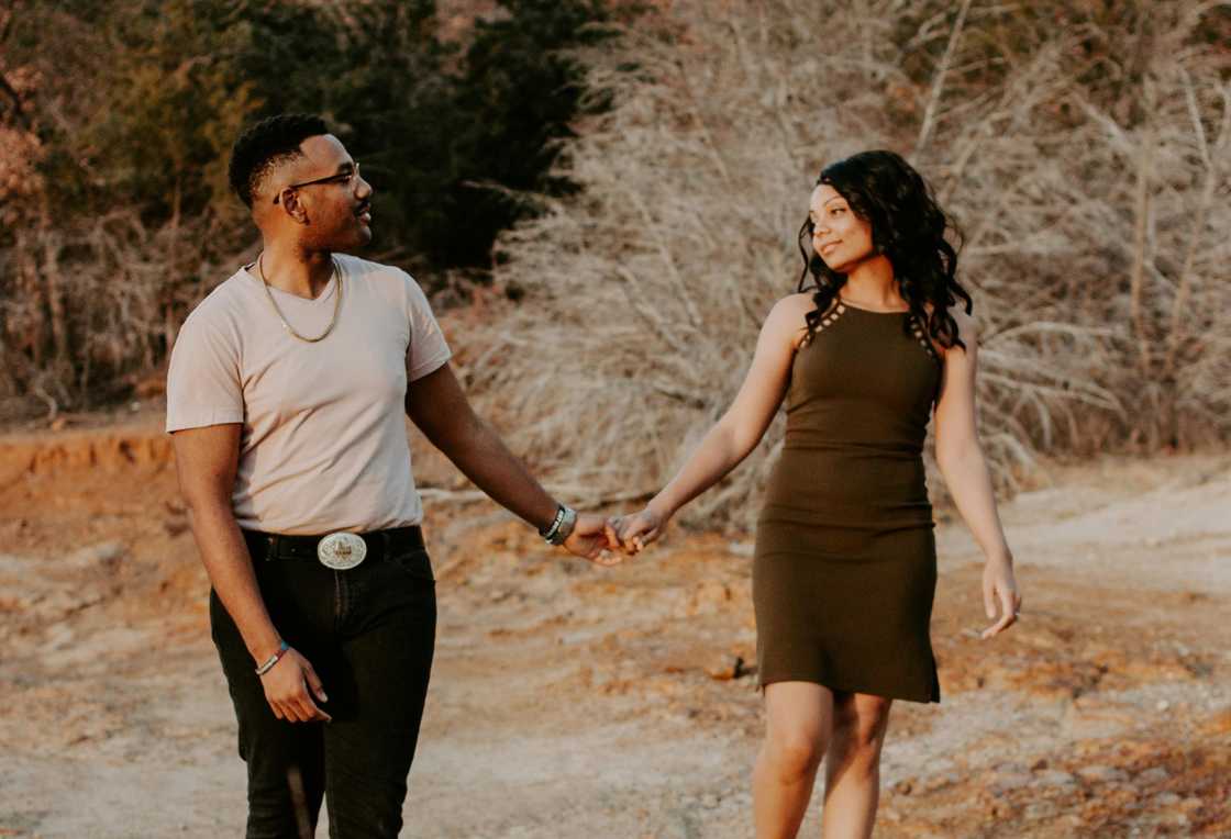 A happy couple holding hands