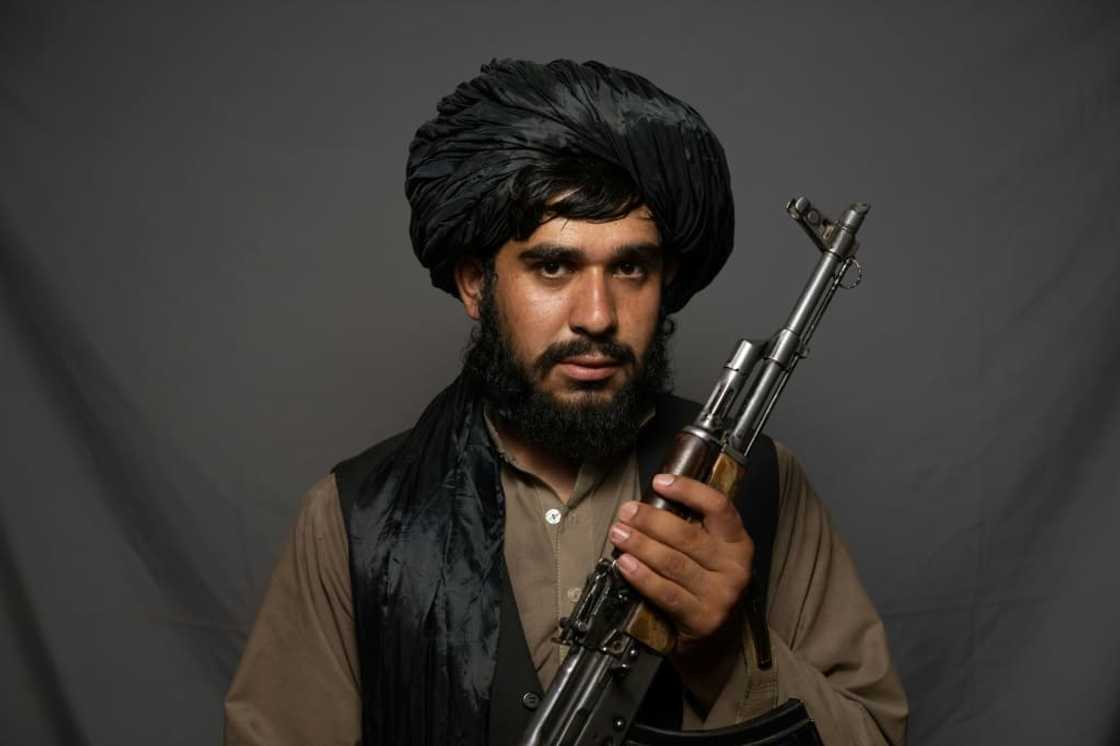 'I'm happy that the infidels are out,' said fighter Sharifullah Khobib 'I'm happy that the infidels are out,' said fighter Sharifullah Khobib