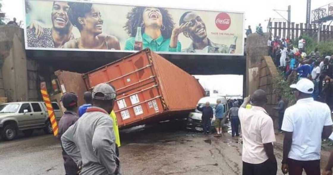 Truck crash, truck accident, crash under bridge, billboard, laughing people billboard, Coca-Cola billboard, trending news, viral posts