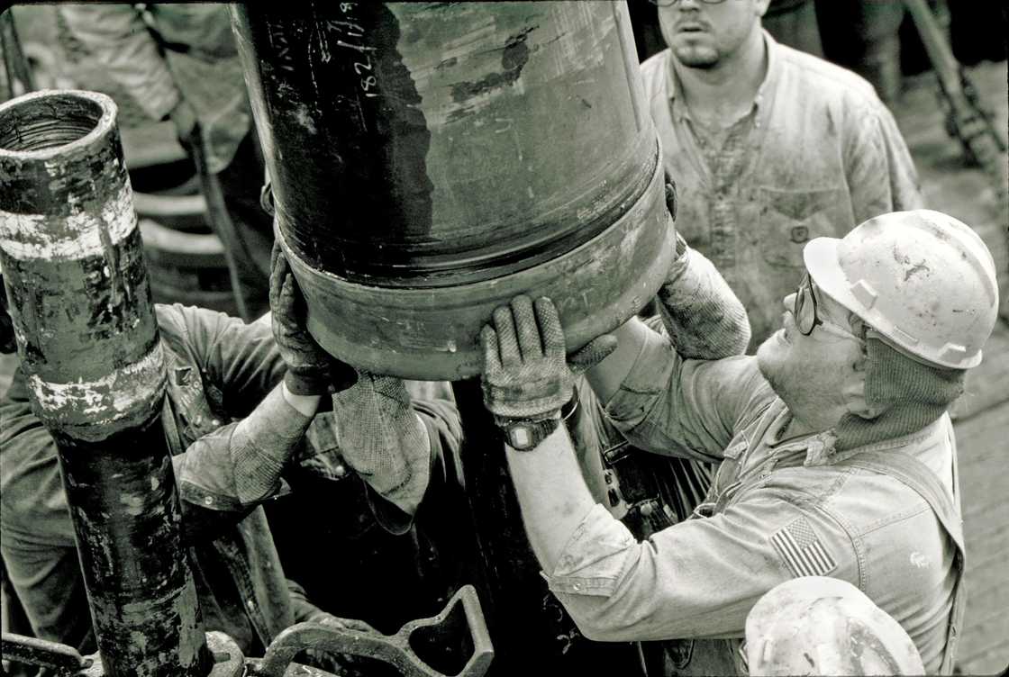 Roughnecks at a drilling site