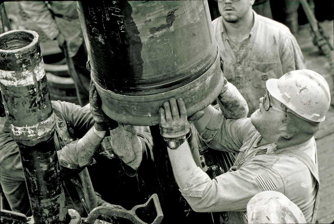 Roughnecks at a drilling site Roughnecks at a drilling site