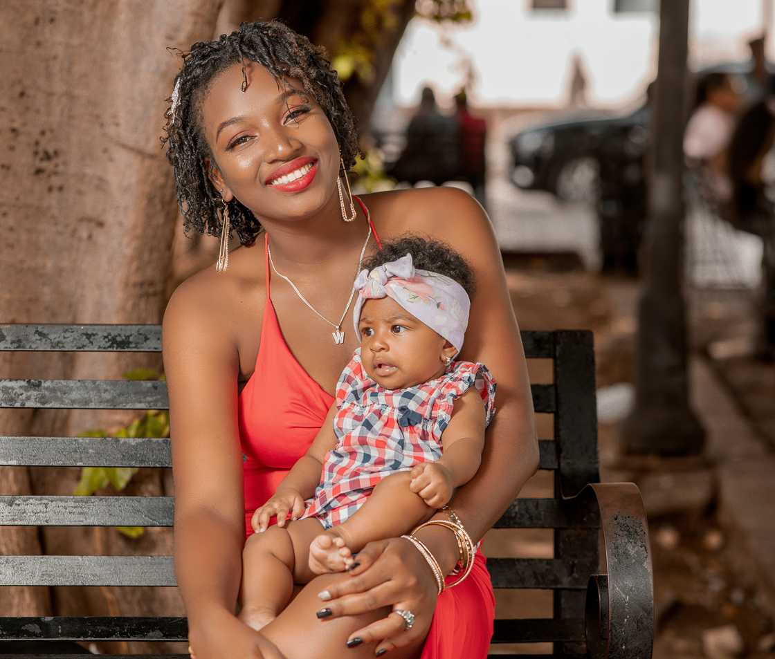 A happy woman holding her daughter