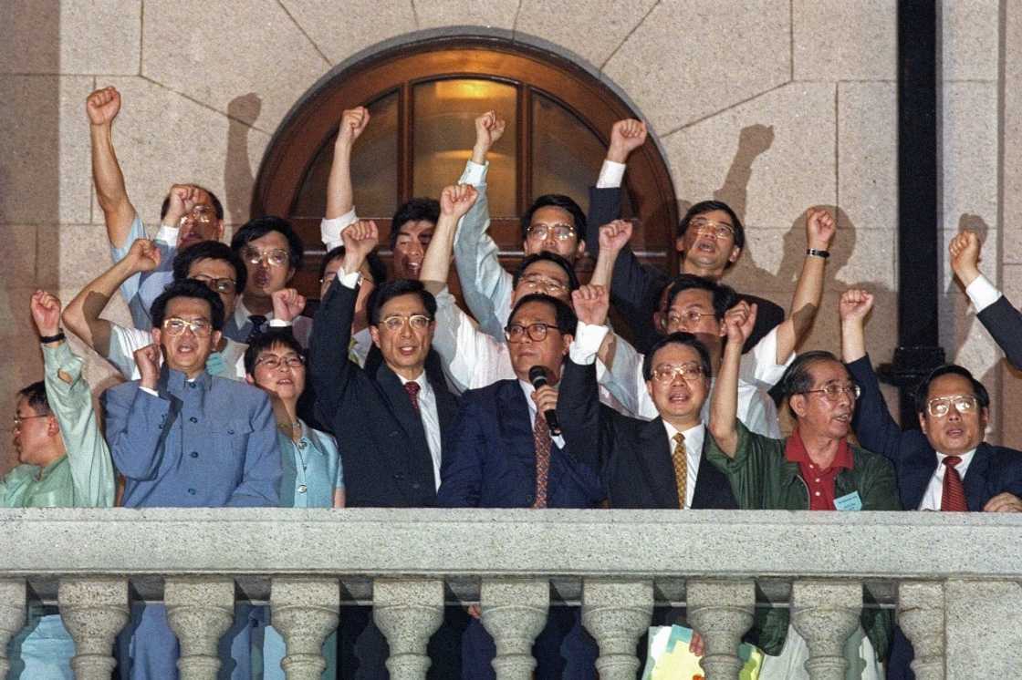Pro-democracy politicians on the balcony of the city's legislature protest their unseating following Hong Kong's handover to China Pro-democracy politicians on the balcony of the city's legislature protest their unseating following Hong Kong's handover to China