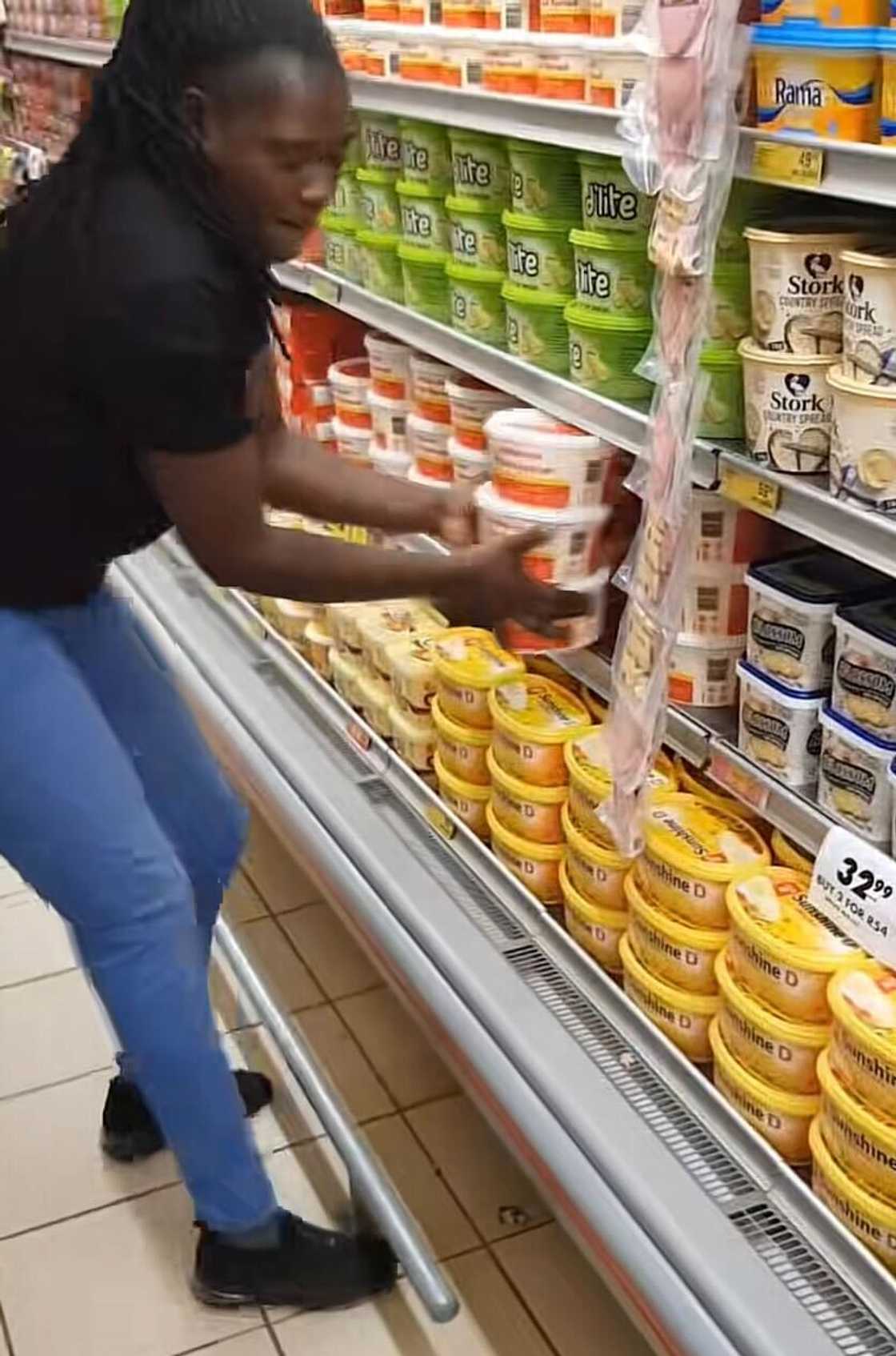 A woman grabbed butter during an impressive trolley dash that wowed South Africans. A woman grabbed butter during an impressive trolley dash that wowed South Africans.