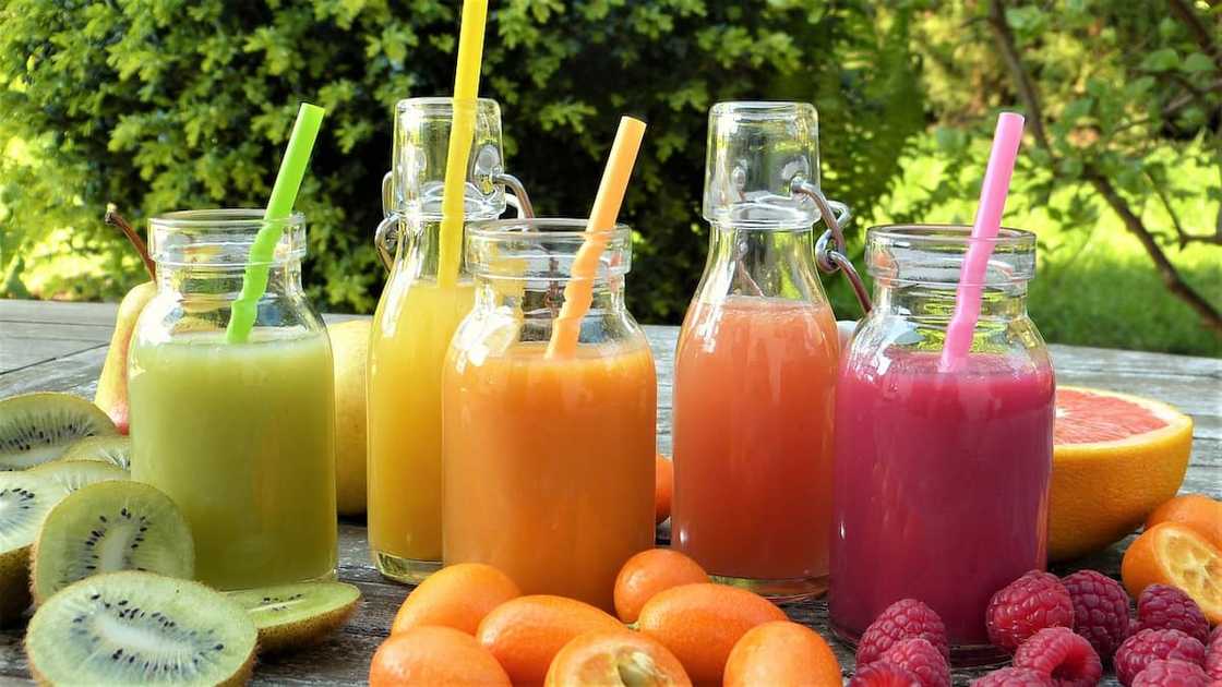 Assorted fruit smoothies in glass bottles Assorted fruit smoothies in glass bottles