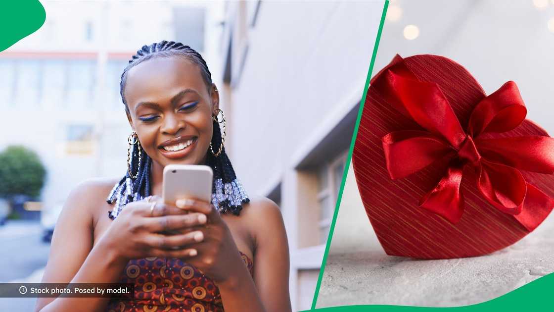 A woman smiling at her phone about a Valentine's Day post.