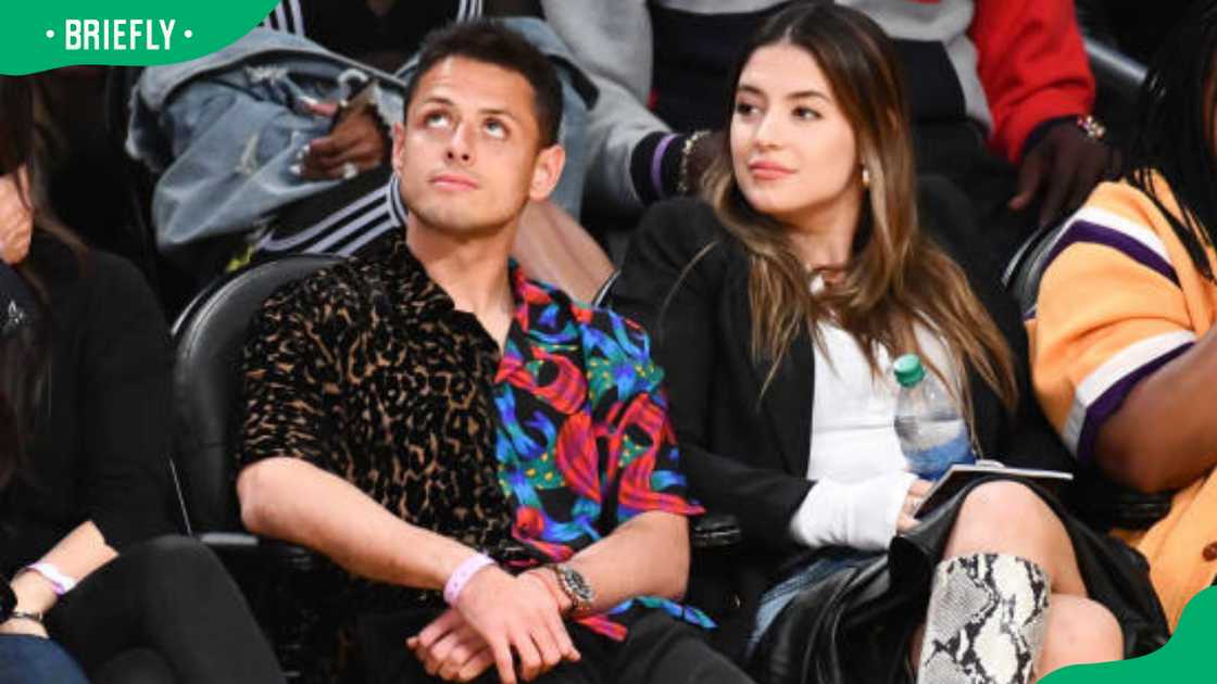 Chicharito and Sarah Kohan at a basketball game Chicharito and Sarah Kohan at a basketball game