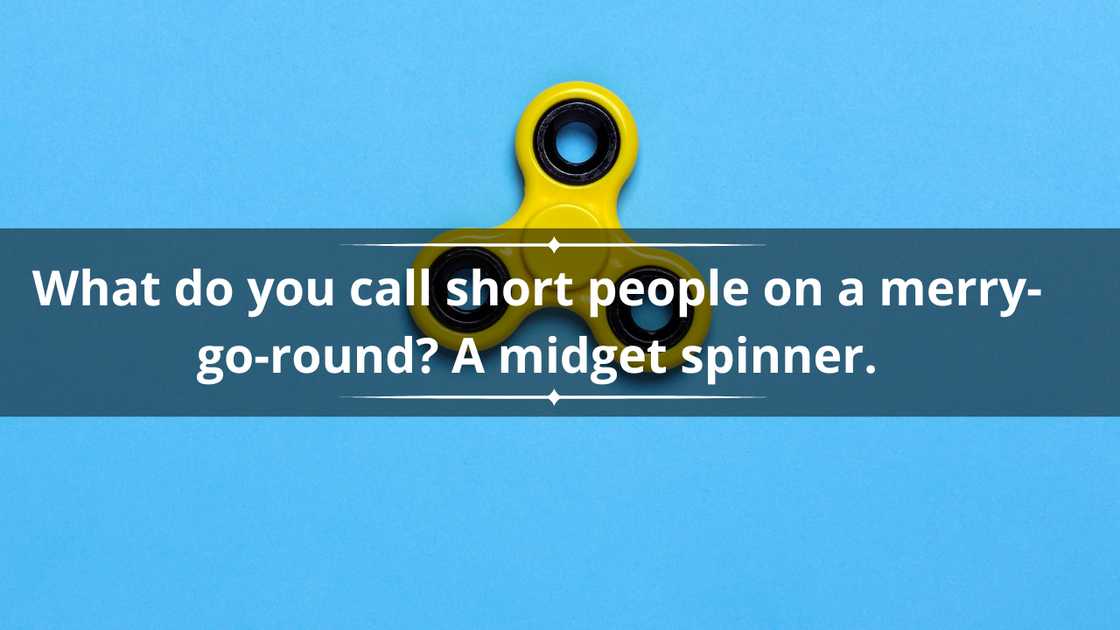 A yellow tri-spinner fidget toy on a blue tabletop