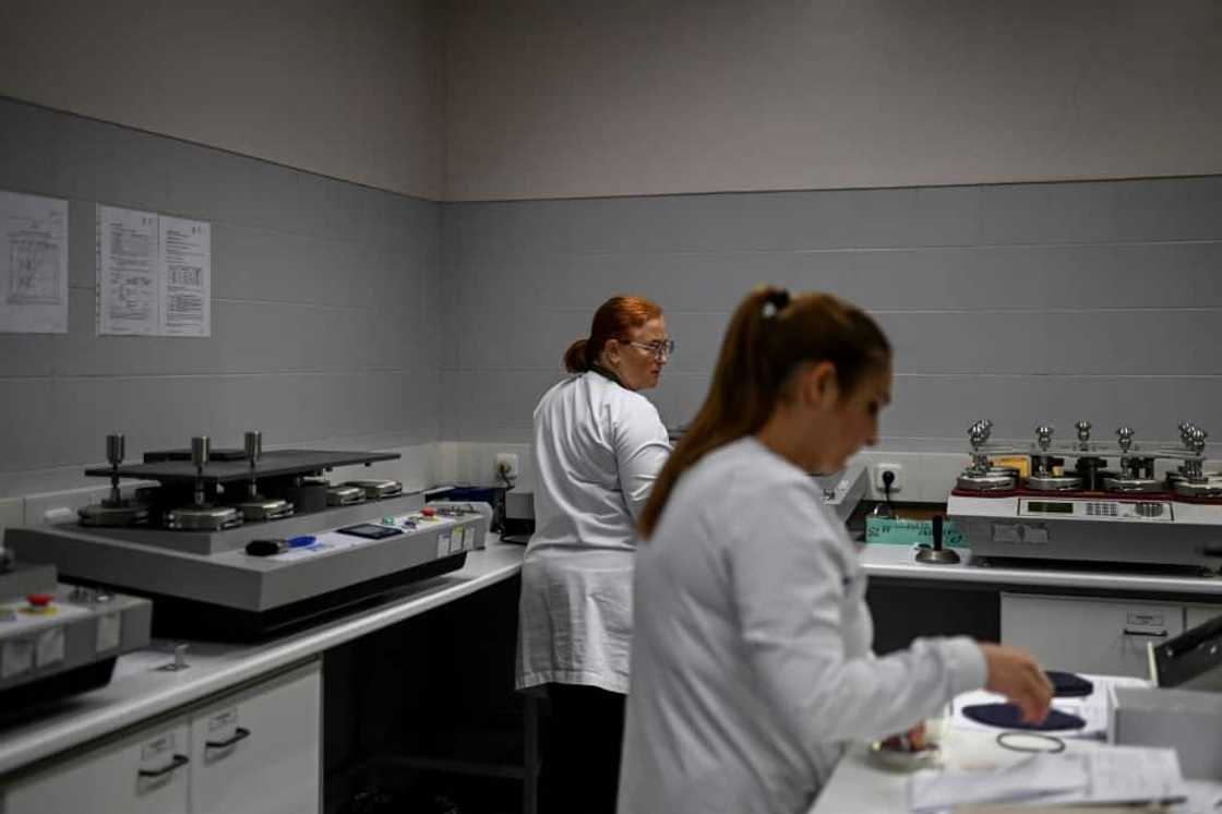 Engineers of the technological institute for textiles and clothing test fabrics in Vila Nova de Famalicao