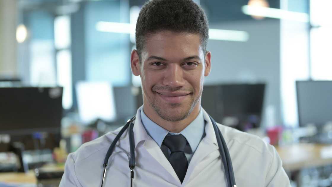 An African doctor saying Yes with head gesture