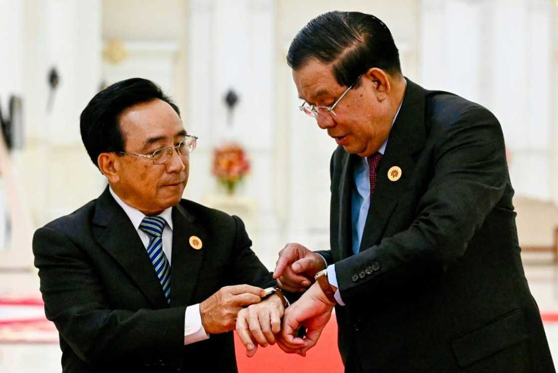 Cambodia's Prime Minister Hun Sen (R) is gifting leaders like Laos' Prime Minister Phankham Viphavanh locally made watches Cambodia's Prime Minister Hun Sen (R) is gifting leaders like Laos' Prime Minister Phankham Viphavanh locally made watches
