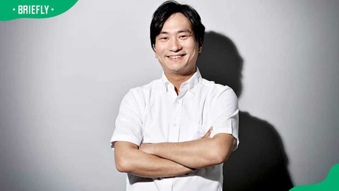 A mean wearing a short-sleeve shirt A mean wearing a short-sleeve shirt