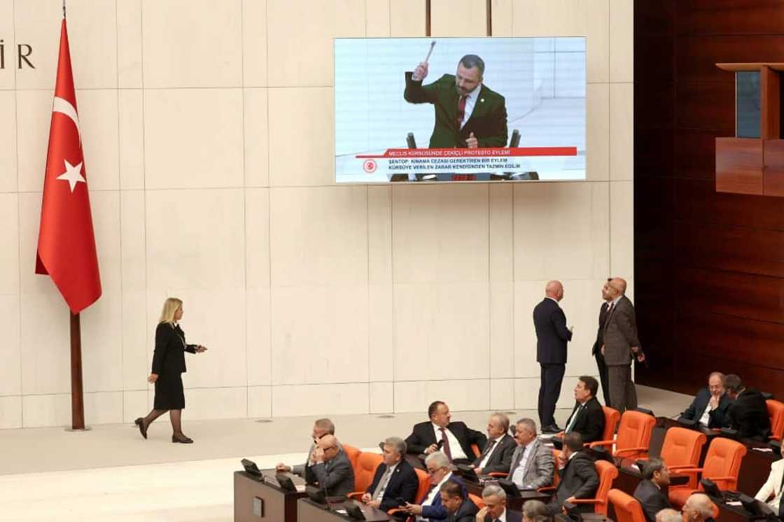 One Turkish opposition lawmaker smashed his phone in parliament in protest at the tough new social media rules One Turkish opposition lawmaker smashed his phone in parliament in protest at the tough new social media rules