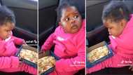 Adorable video of baby girl blowing on hot pizza has Mzansi hearts melting like cheese: “She is so smart”