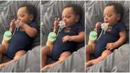 Video of baby boy with brilliant hand coordination feeds himself with milk leaves netizens stunned