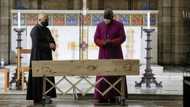 Leah Tutu and daughter Thandeka escort father Desmond Tutu's coffin as it arrives at St George's Cathedral in Cape Town