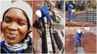 Young lady who works as bricklayer for a living showcases her work with pride