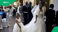 Venda brides kneels while receiving money at wedding in TikTok video