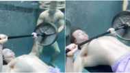 Young man wows many as he lifts weight under water effortlessly in adorable video