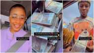 Young lady keeps bundles of cash inside car, hands them to hawkers in viral video