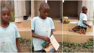 Dedicated kid hawking does his school assignment by roadside in touching video