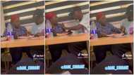 "Wife material": African man enters restaurant, starts eating lady's food in prank video, she looks surprised