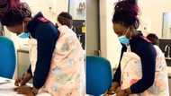 Local nurse holds baby while mom gets treated, photos go viral