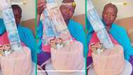 Video of mother's reaction to money cake gift melts Mzansi's hearts: "She's already counting it"