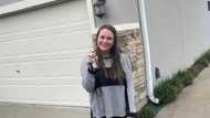 Lady who lived in trailer buys own house, celebrates win with adorable photo