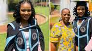 Smart lady looks pretty in pink celebrating master's graduation with loved ones