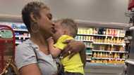 Kind woman helps mom comfort 1 of her crying kids so she could continue shopping