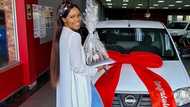 Young lady proudly celebrates as her side hustle helps her buy new car